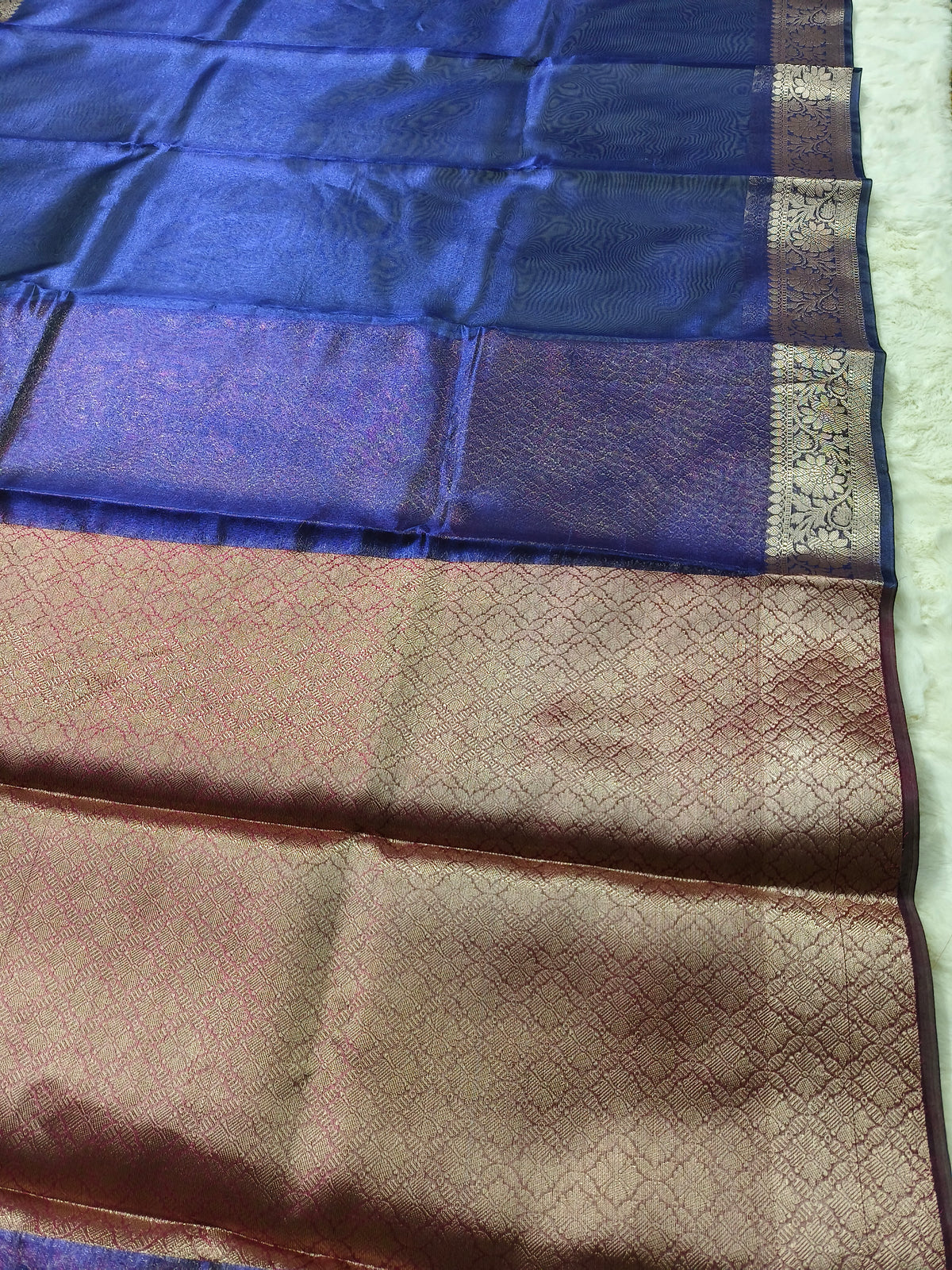 Dual-Tone Royal Sapphire Tissue Saree with Floral Zari Border 3. Shopify Product Description