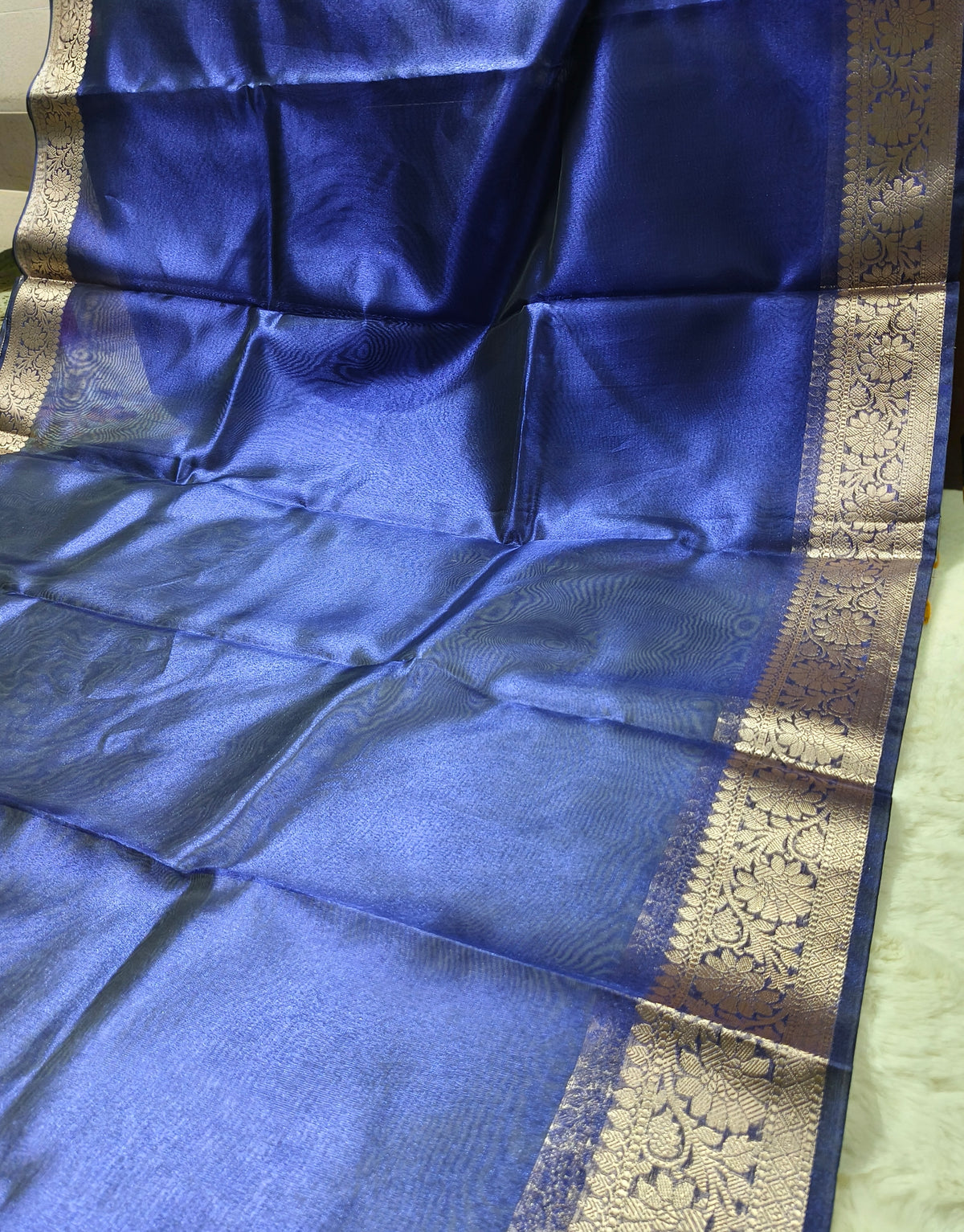 Dual-Tone Royal Sapphire Tissue Saree with Floral Zari Border 3. Shopify Product Description